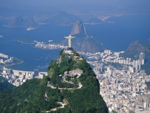 marco simoni rio de janeiro with the cristo redentor in the foreground and the pao de acucar in the background