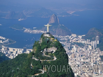 marco simoni rio de janeiro with the cristo redentor in the foreground and the pao de acucar in the background