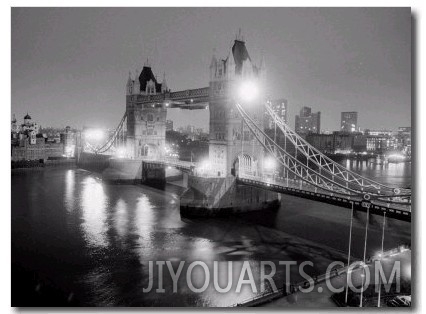 A View of Tower Bridge on the River Thames Illuminated at Night in London, April 1987