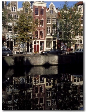 Tall Traditional Style Houses Reflected in the Water of a Canal, Amsterdam, the Netherlands