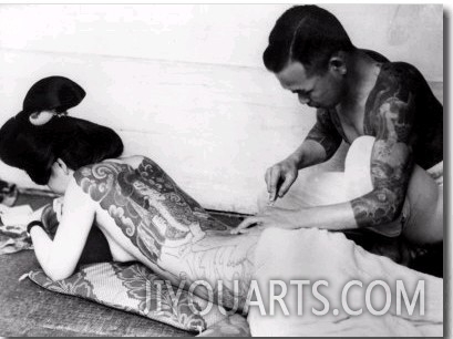 An Unidentified Japanese Tattoo Artist Works on a Woman