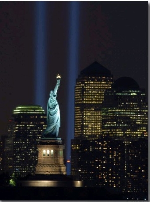 Lights from the Former World Trade Center Site Can be Seen on Both Sides of the Statue of Liberty