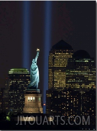 Lights from the Former World Trade Center Site Can be Seen on Both Sides of the Statue of Liberty