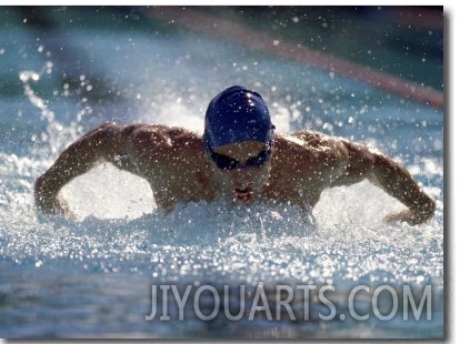 Young Man Swimming the Butterfly Stroke