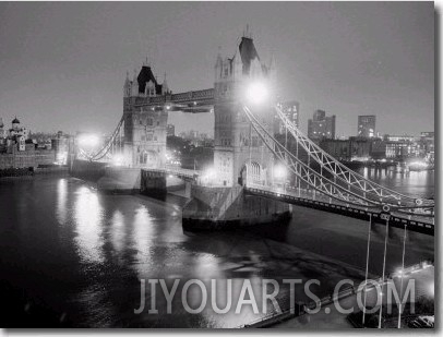 A View of Tower Bridge on the River Thames Illuminated at Night in London, April 1987