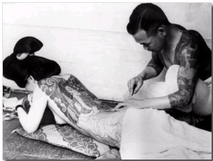 An Unidentified Japanese Tattoo Artist Works on a Woman