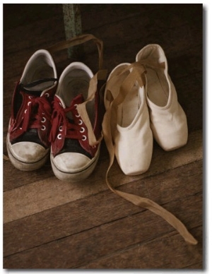 A Pair of Ballet Toe Shoes Rest Next to a Pair of Tennis Shoes