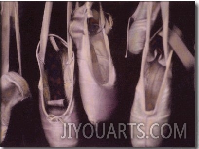 Worn Ballet Shoes Hanging in a Window