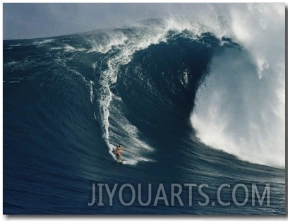 Surfer Rides a Powerful Wave off the North Shore of Maui Island