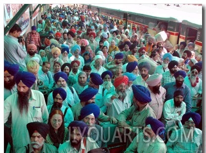 Indian Sikh Pilgrims Wait for Immigration Clearance at Wagah Railway Station Near Lahore