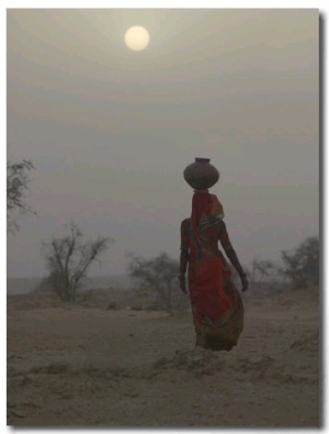 Woman Carrying Water Jar in Sand Storm, Thar Desert, Rajasthan, India