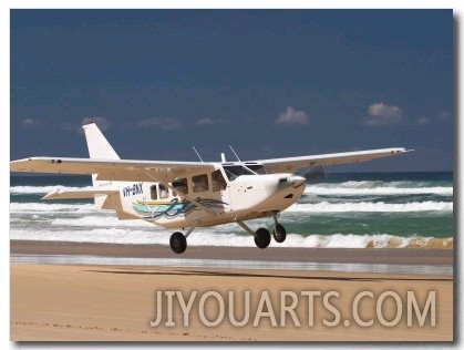 Plane About to Land on Seventy Five Mile Beach, Queensland, Australia