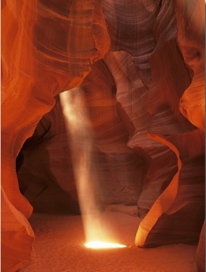 Sunbeam Illuminates Sandy Floor and Sandstone Walls of a Slot Canyon, Antelope Canyon, Page