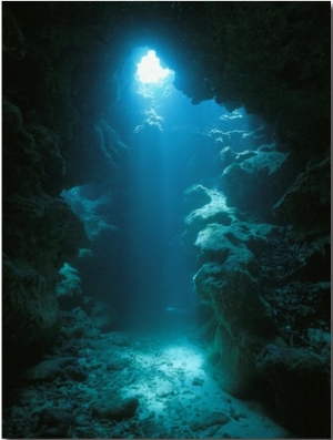 A Beam of Sunlight Illuminates an Underwater Cave