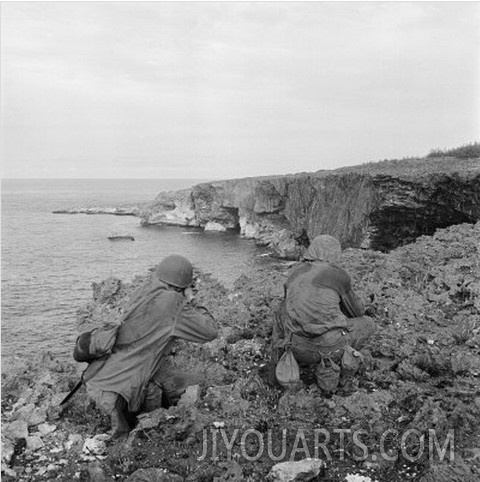 American Marines Searching Craggy Cliffs for Japanese Snipers and Island Civilians