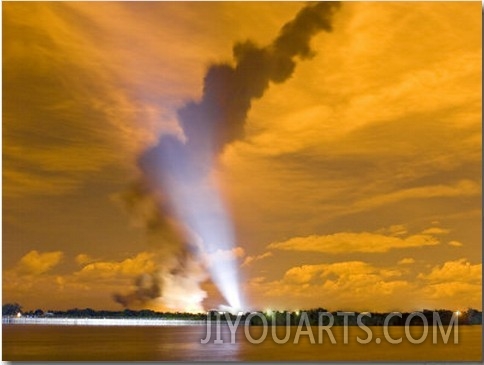 Space Shuttle Blasting Off Lights Up the Night Sky a Bright Orange