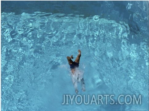 A Swimmer Dives into a Swimming Pool