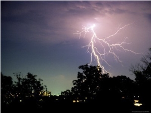 Bolt of Lightning Brightens a Night Sky