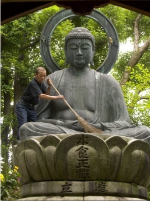 Man Cleaning a Buddha Statue, Shinnyo Do Temple, Kyoto, Kinki, Japan