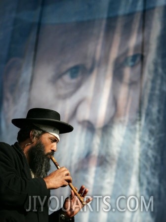 An Ultra Orthodox Jewish Man Plays a Flute