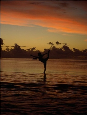 Woman Doing Yoga in Water at Sunset, Tahiti