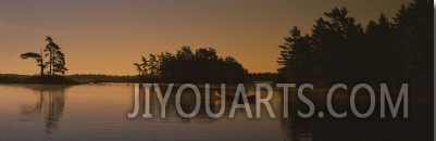 Silhouette of a Person in a Canoe on a Lake, Kejimkujik Lake, Nova Scotia, Canada